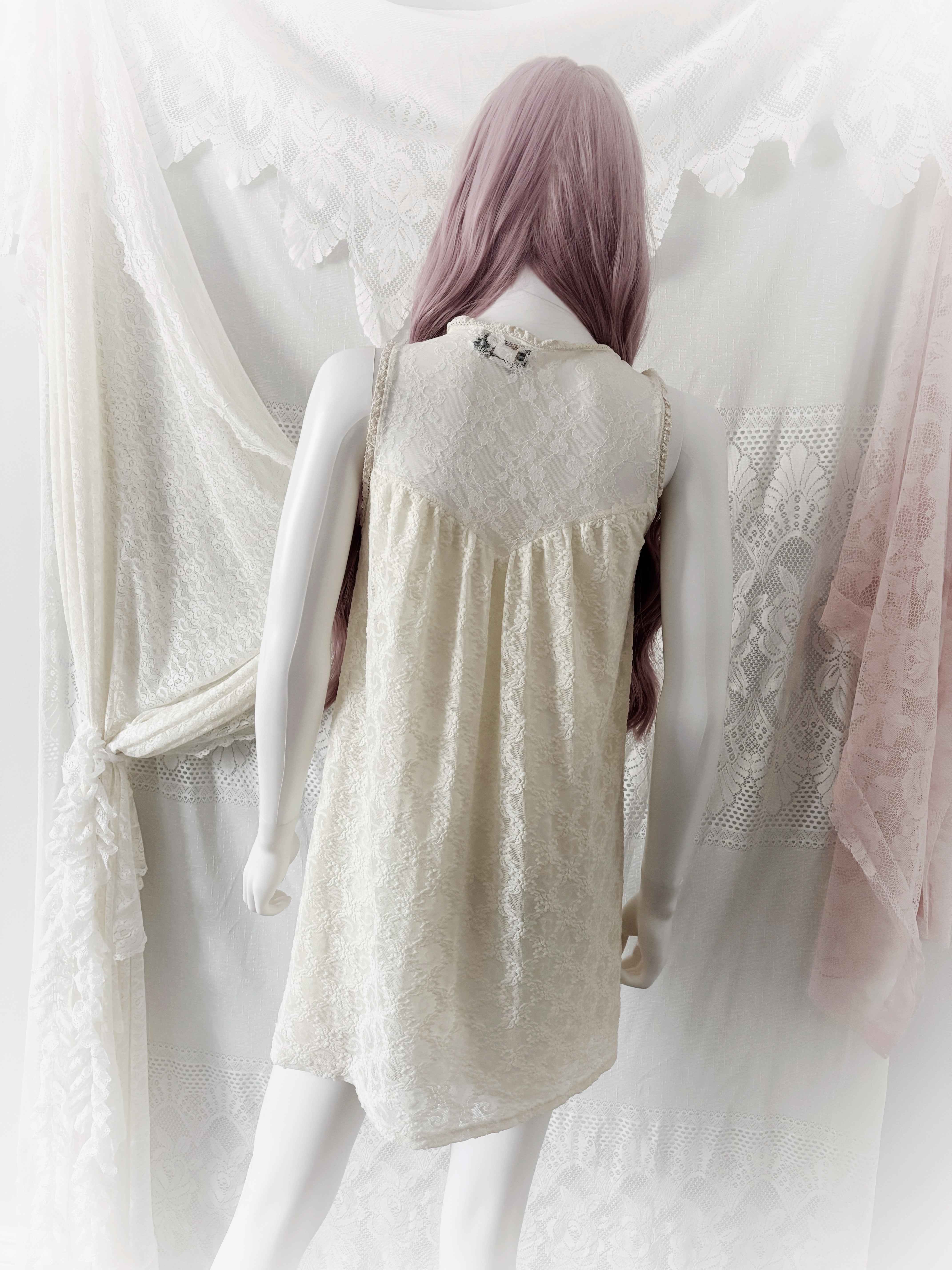 Cream lace baby doll dress with floral and pearl details